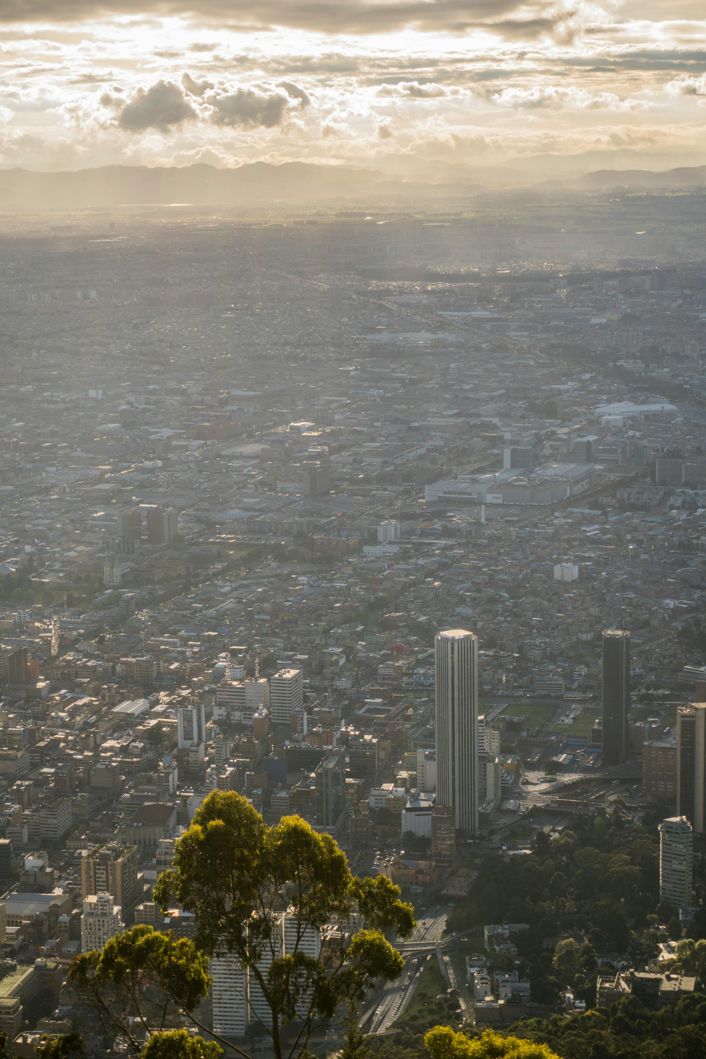 Bogotá rooftops with the Andes at dusk