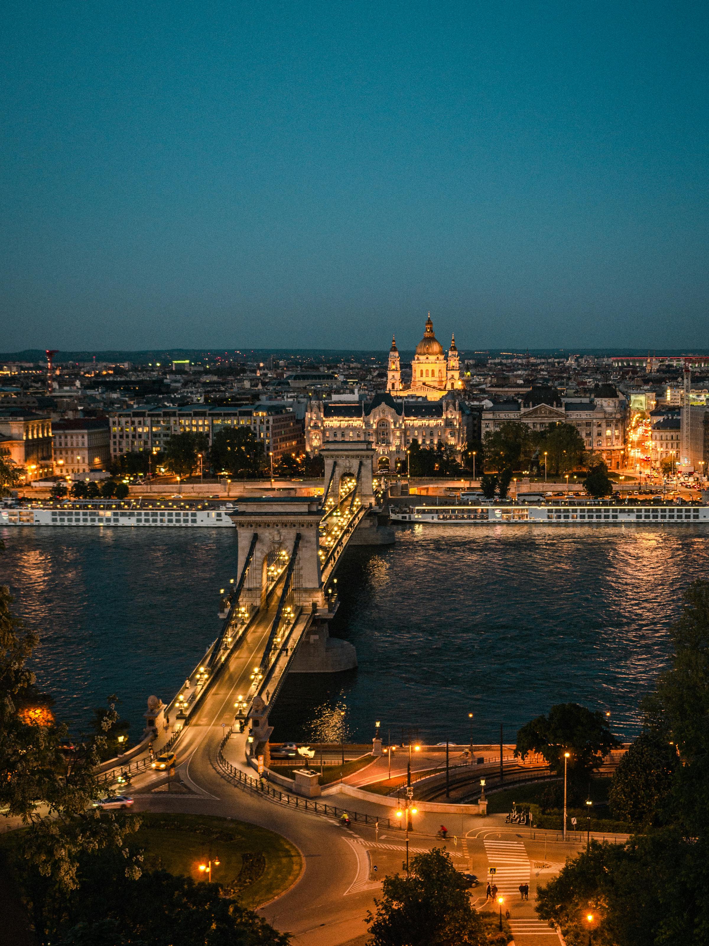 Budapest Parliament reflected on the Danube at blue hour