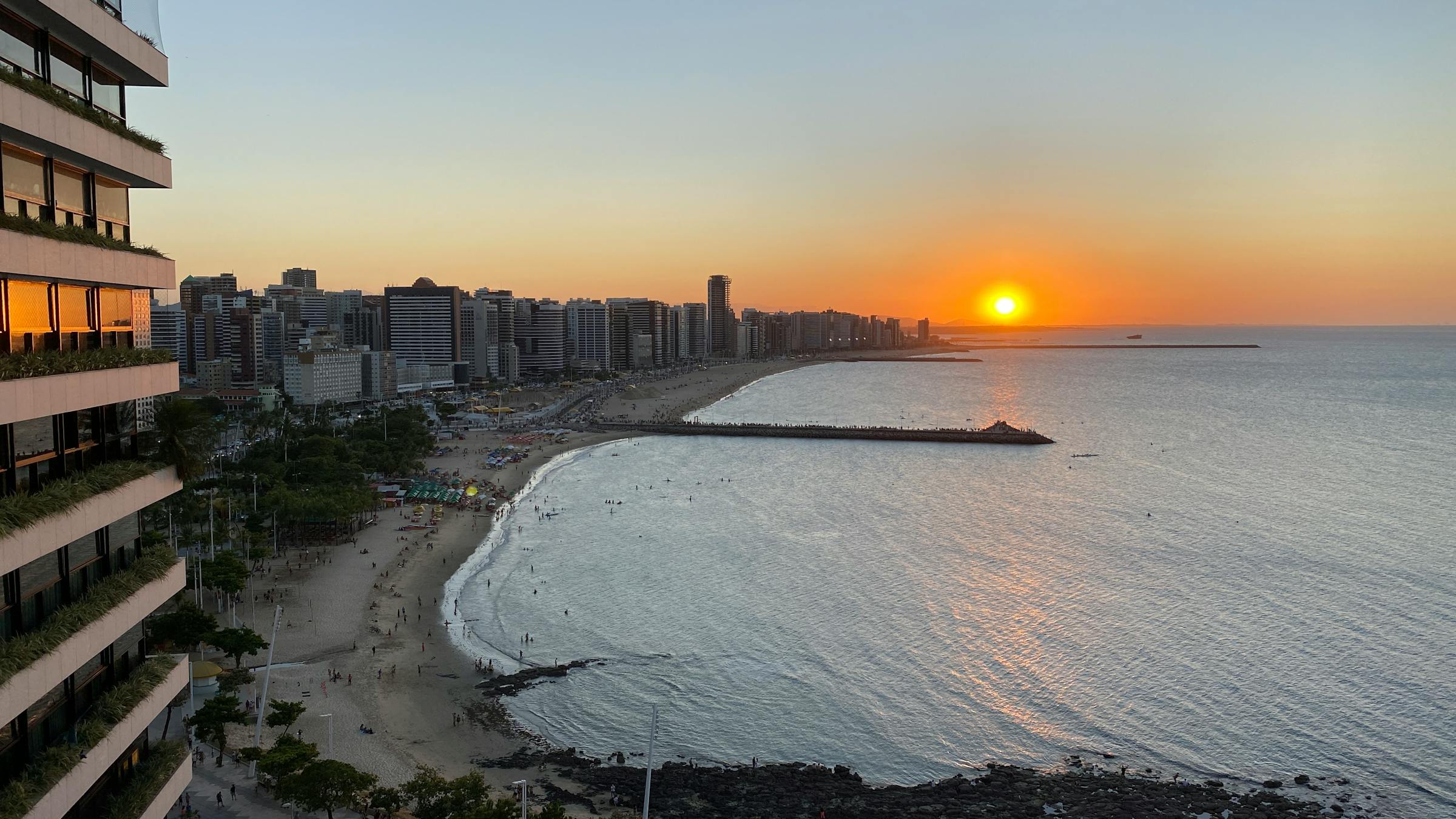 Fortaleza beach at sunset with palm trees