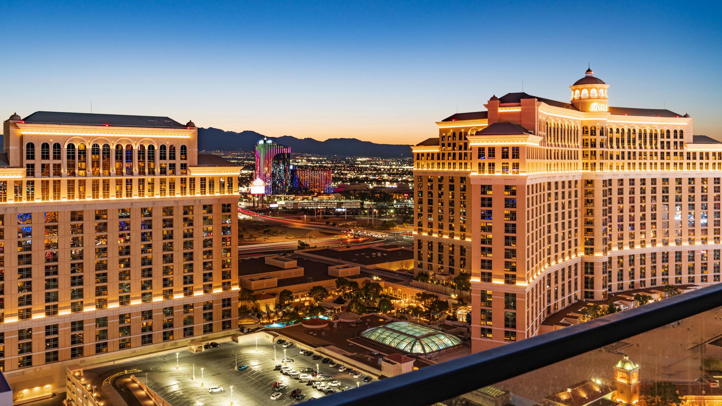Las Vegas Strip at twilight with neon lights coming on