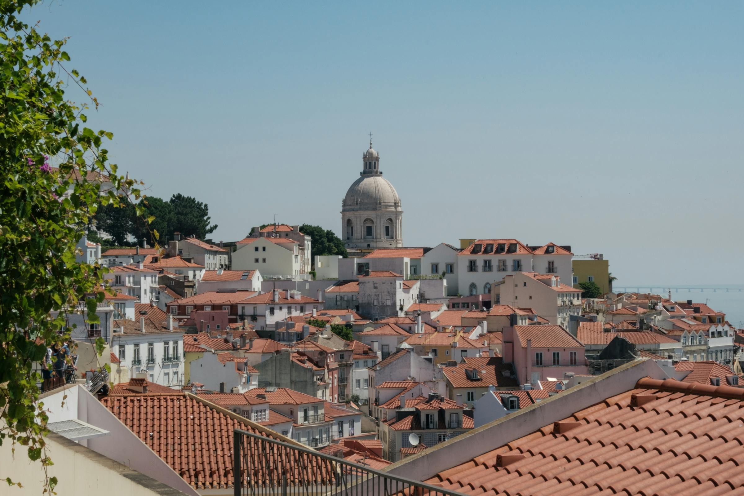 View over Lisbon's Alfama rooftops at sunset