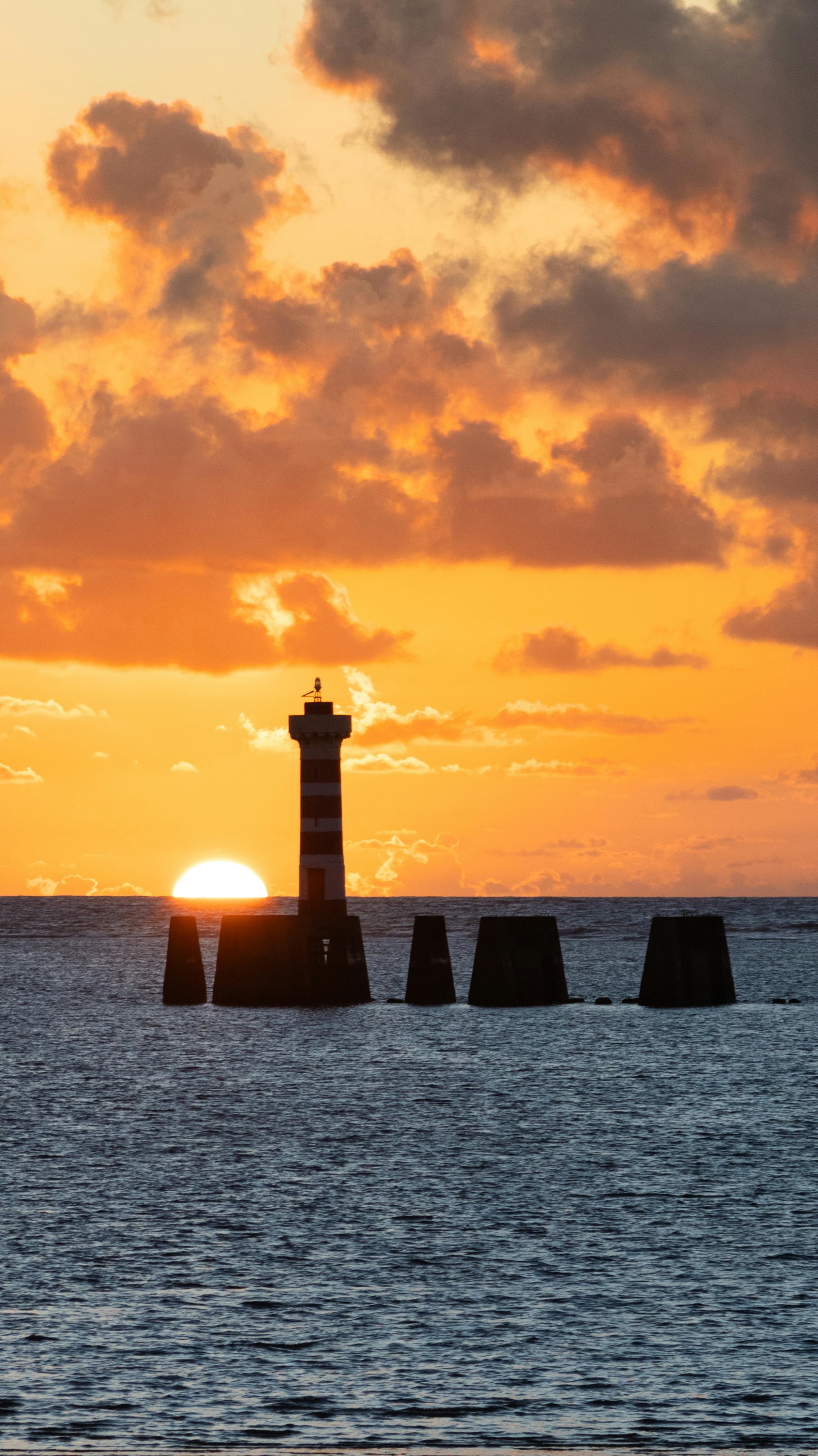 Maceió beach with turquoise water and rafts at sunset