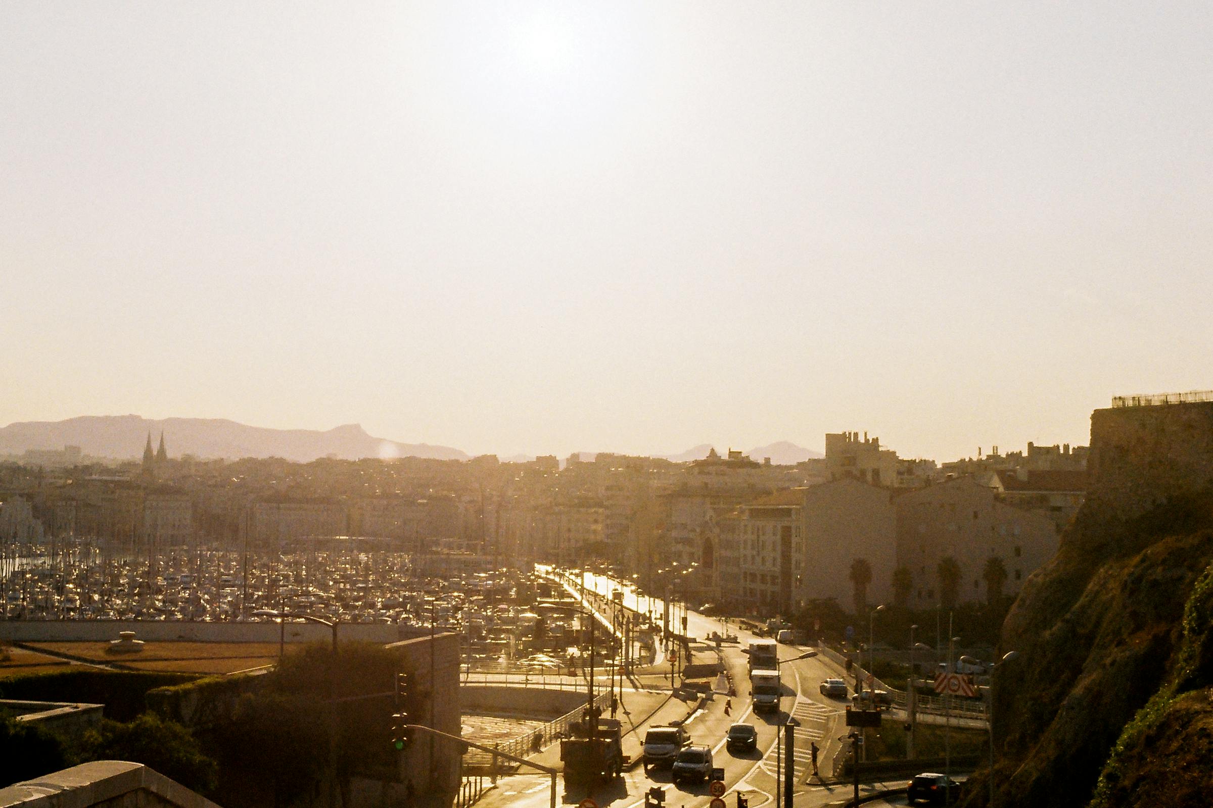 Marseille old port with sailboats at golden hour